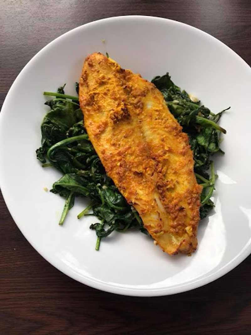 Masala Fish On A Bed Of Spinach